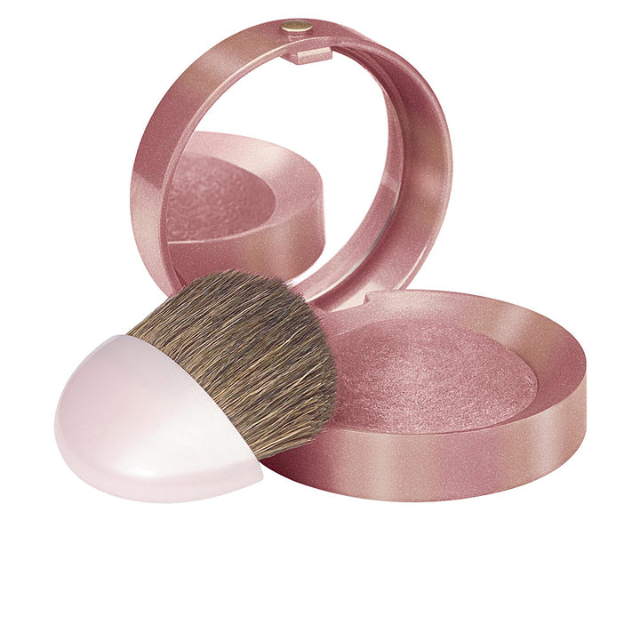 Round baked compact blush in soft rose shade with mirror and small brush