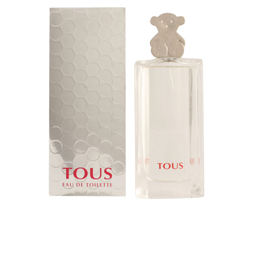 Clear 90 ml floral eau de toilette bottle with decorative cap, 2002 fragrance
