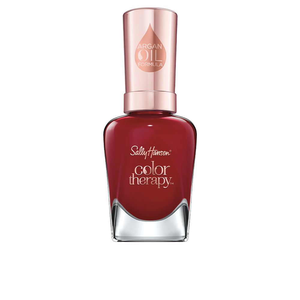 Glass bottle of deep berry nail polish with slender brush, 14.7 ml