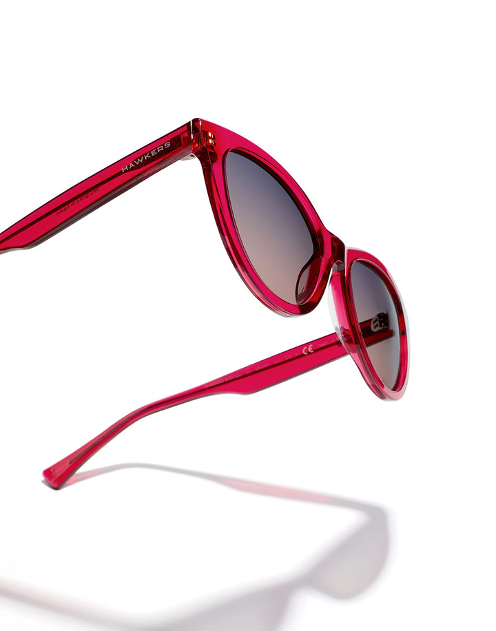 Unisex cat‑eye sunglasses in translucent cherry acetate with grey‑to‑pink gradient lenses