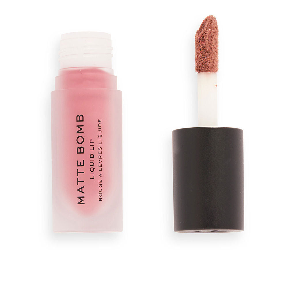 Tube of matte liquid lipstick, vivid fuchsia shade, doe‑foot applicator visible