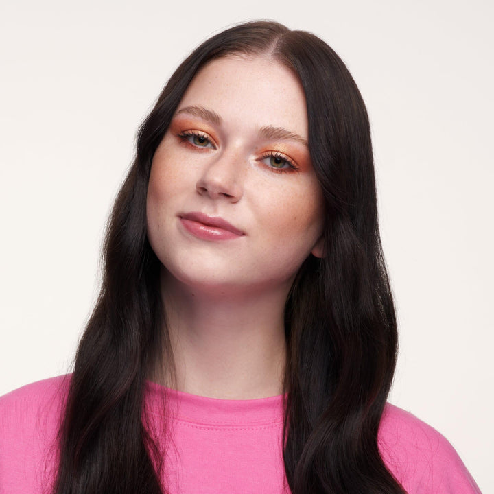 Cream bronzer stick in compact tube, warm tan shade, 5.5 g