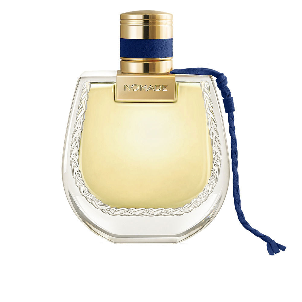 Deep blue 75 ml eau de parfum bottle with braided cap and amber-hued liquid
