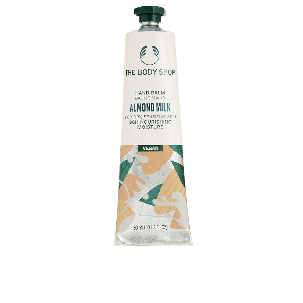 The Body Shop Creamy almond milk hand balm in a metallic tube with screw cap, leaf and almond illustrations