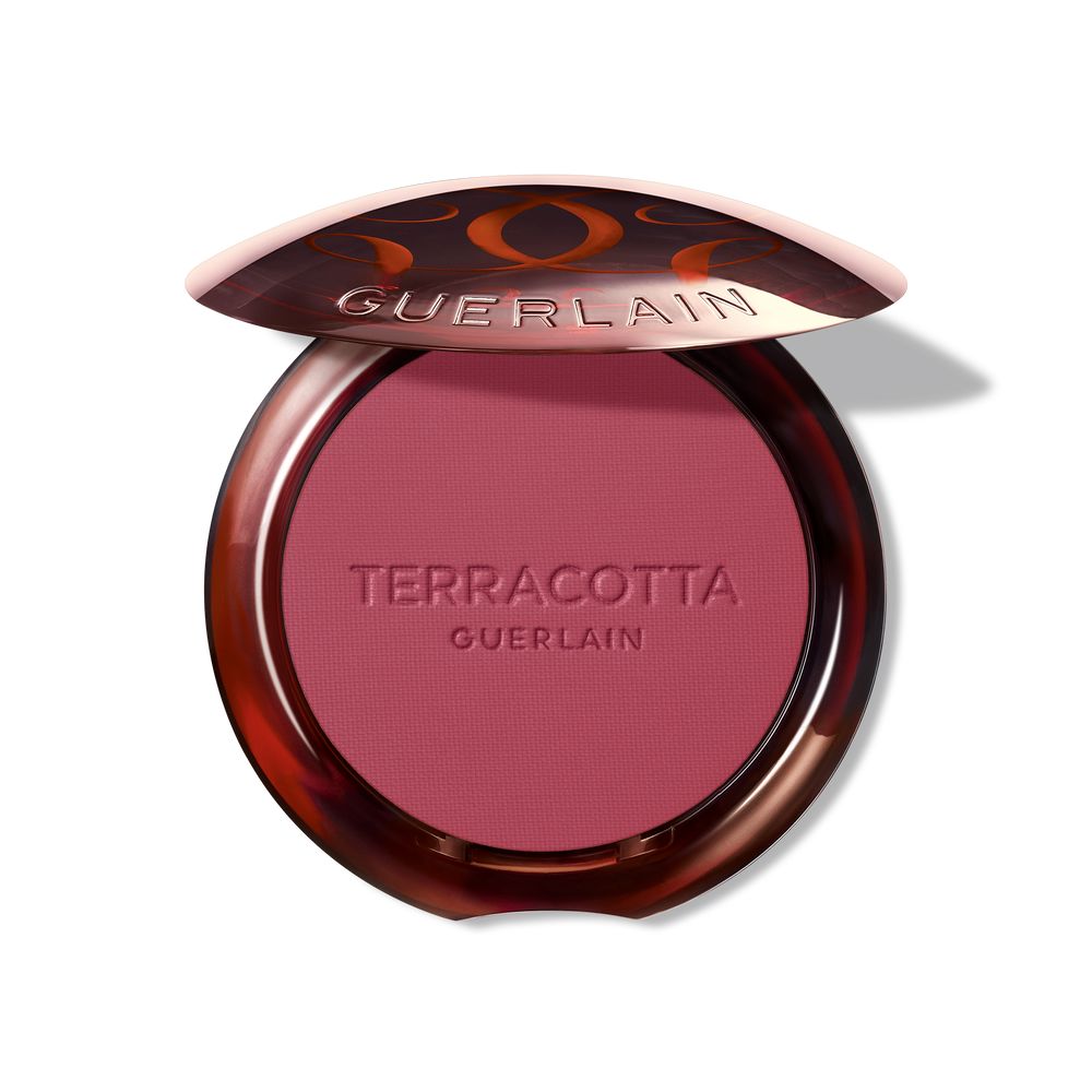 Mini terracotta powder blush compact in rose shade, lightweight finish