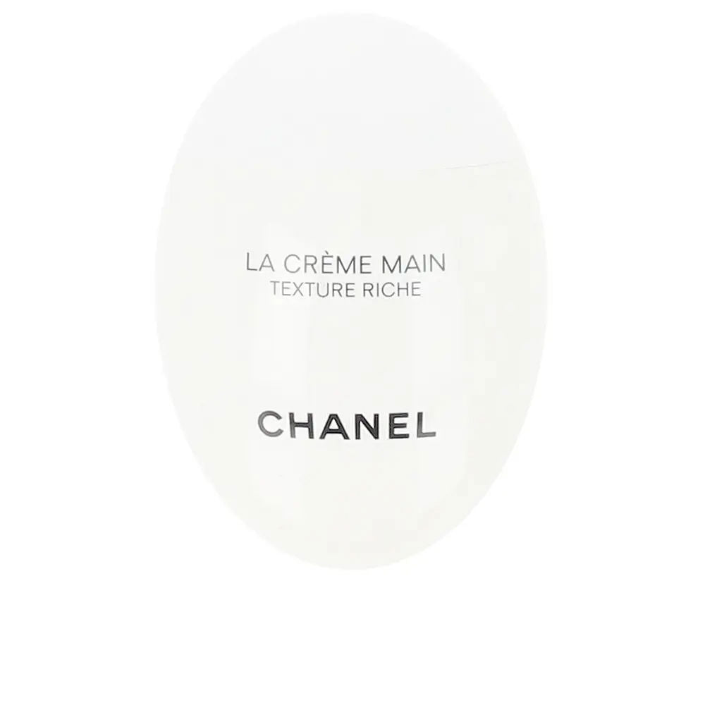 White oval hand cream tube with printed text and smooth texture, minimalist design, brand Chanel