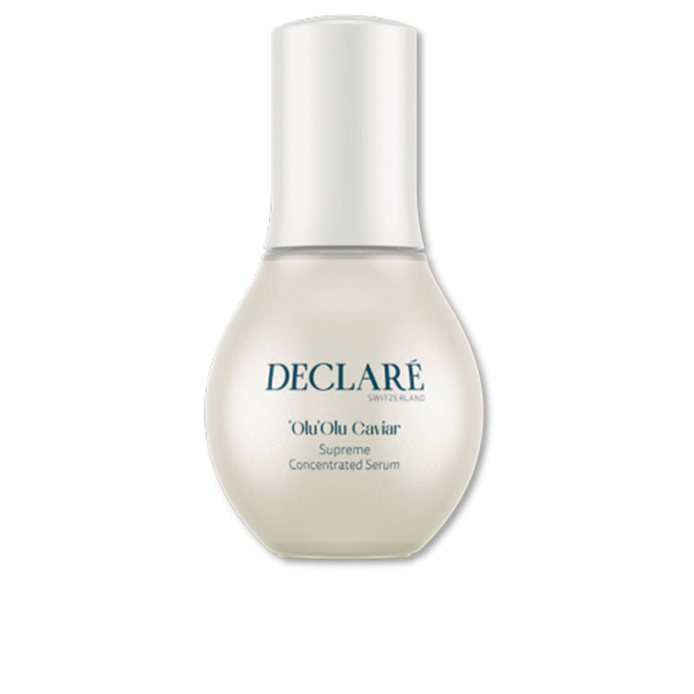 Glass dropper serum bottle with pale amber liquid, minimalist label and matte black cap, Declaré