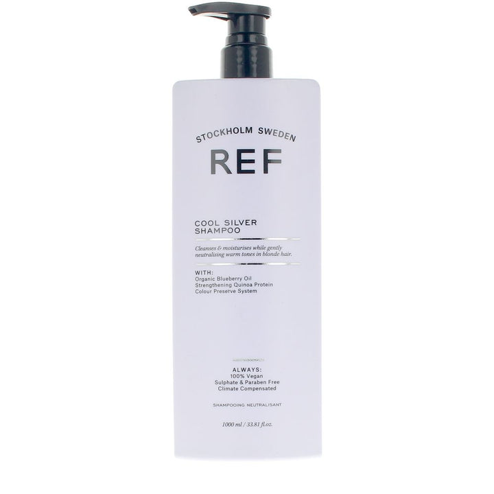 Tall 1,000 ml bottle of violet-blue cool silver shampoo for blondes and grey hair