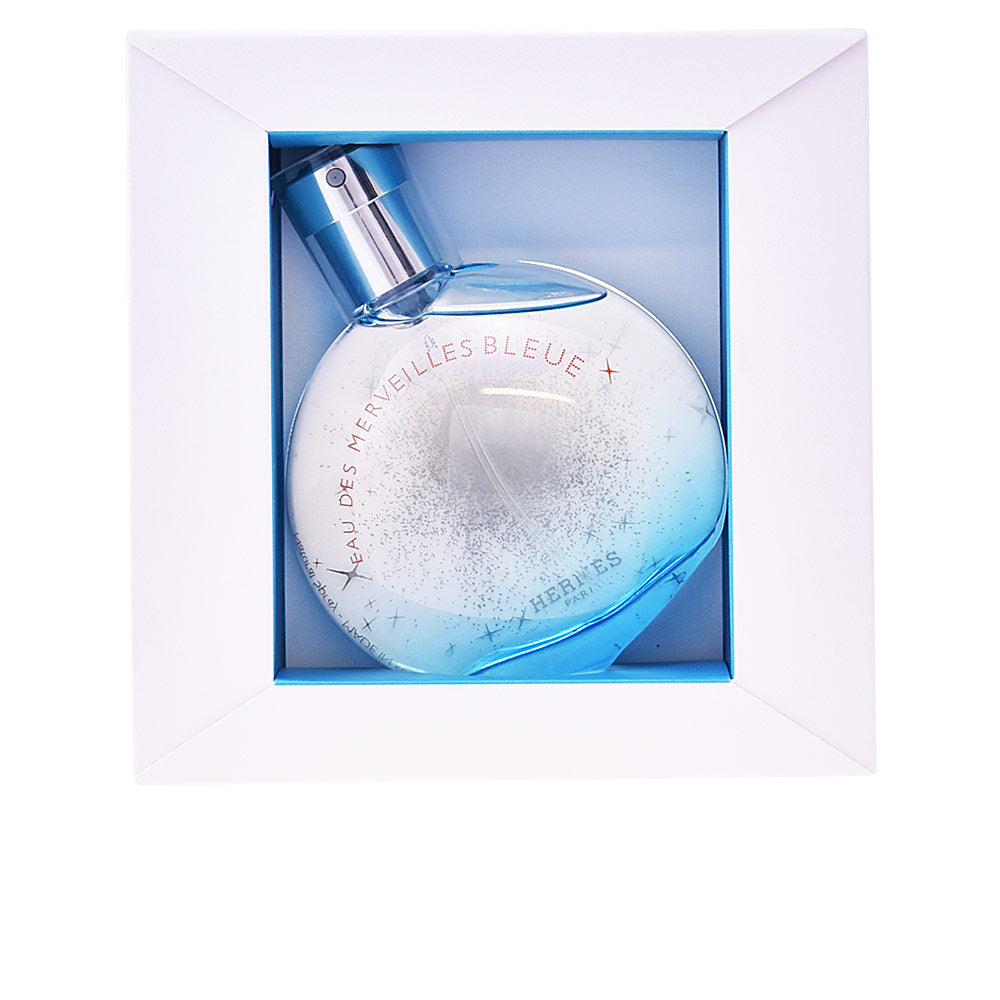 50 ml clear blue-tinted bottle with lens-shaped stopper, aquatic amber fragrance