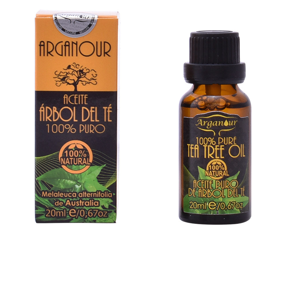 Small amber bottle of Arganour tea tree oil with a dropper on a white surface