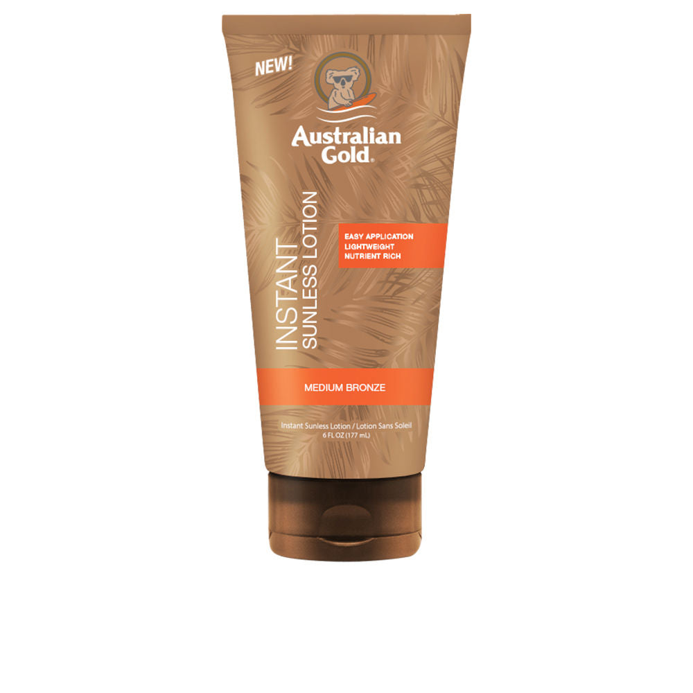 Plastic lotion tube with brown, orange and white finish, flip-top cap, textured leaf-patterned background, Australian Gold