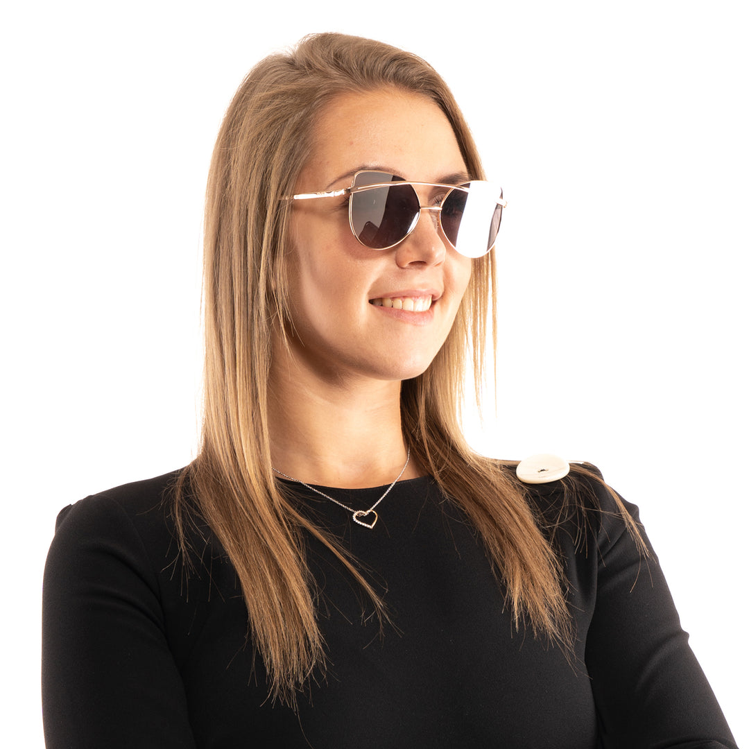 Rose gold metal cat-eye sunglasses with double bridge and grey lenses, shown front-on