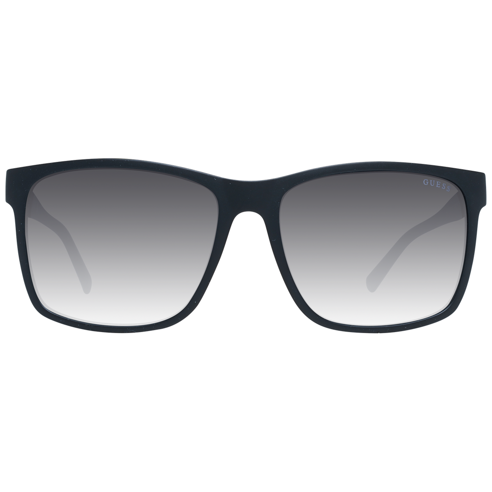 Black rectangular sunglasses on neutral background with gradient lenses and visible logo on temple