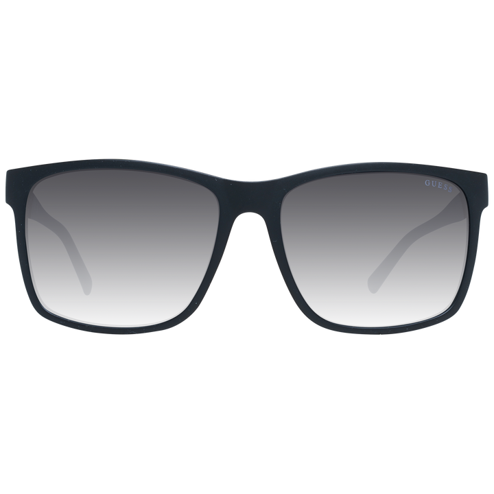 Black rectangular sunglasses on neutral background with gradient lenses and visible logo on temple