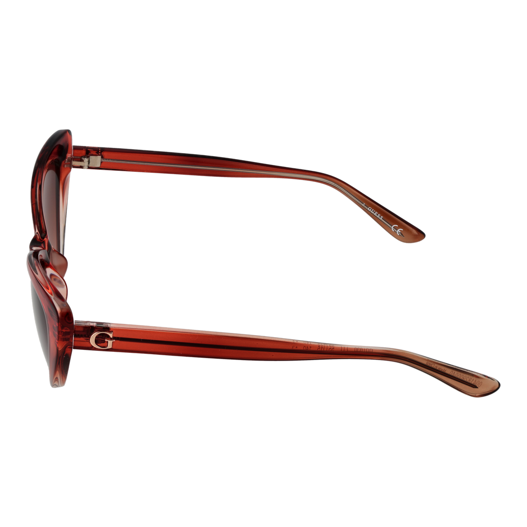 Transparent red cat-eye sunglasses in plastic with gradient lenses shown at three-quarter angle