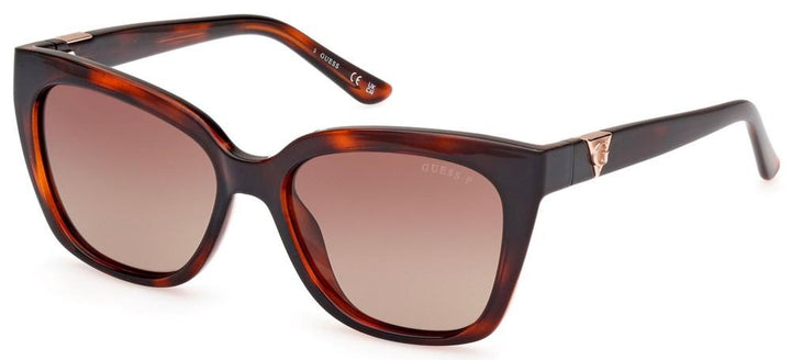 Brown tortoiseshell cat-eye sunglasses with gradient brown lenses and metal temple accents on white background