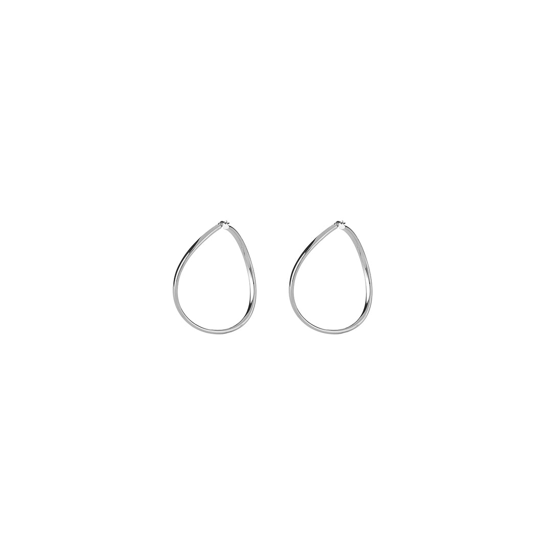 Pair of minimalist silver twisted hoop earrings with hinged closure on white background