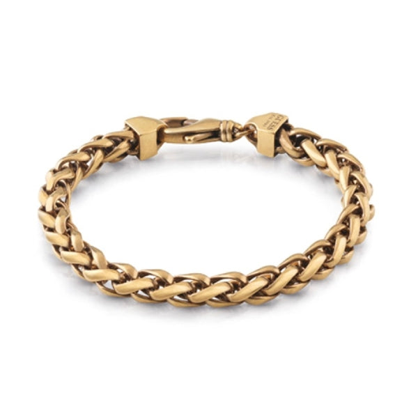 Gold braided metal chain bracelet with interlaced links and closed clasp on neutral background