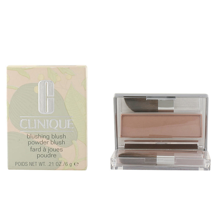 Compact pressed powder blush in Innocent Peach with angled applicator brush