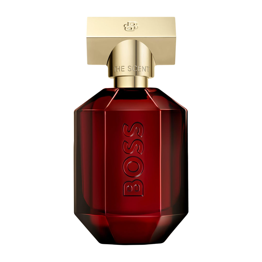 Deep red glass perfume bottle with gold-finish cap, 50 ml, woody-amber fragrance