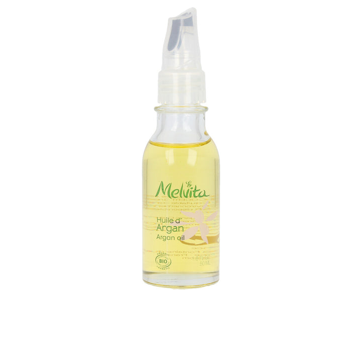 50 ml glass bottle of organic argan oil for skin and hair, amber liquid