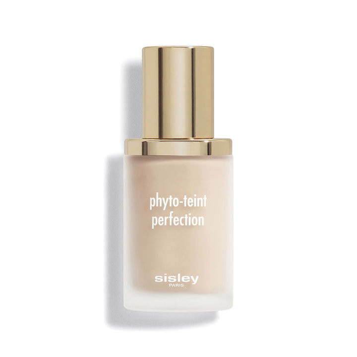 Glass liquid foundation bottle in beige with frosted finish, gold metallic cap, minimalist white print — Sisley