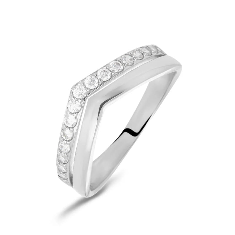 White gold angular ring with row of round diamonds against neutral background